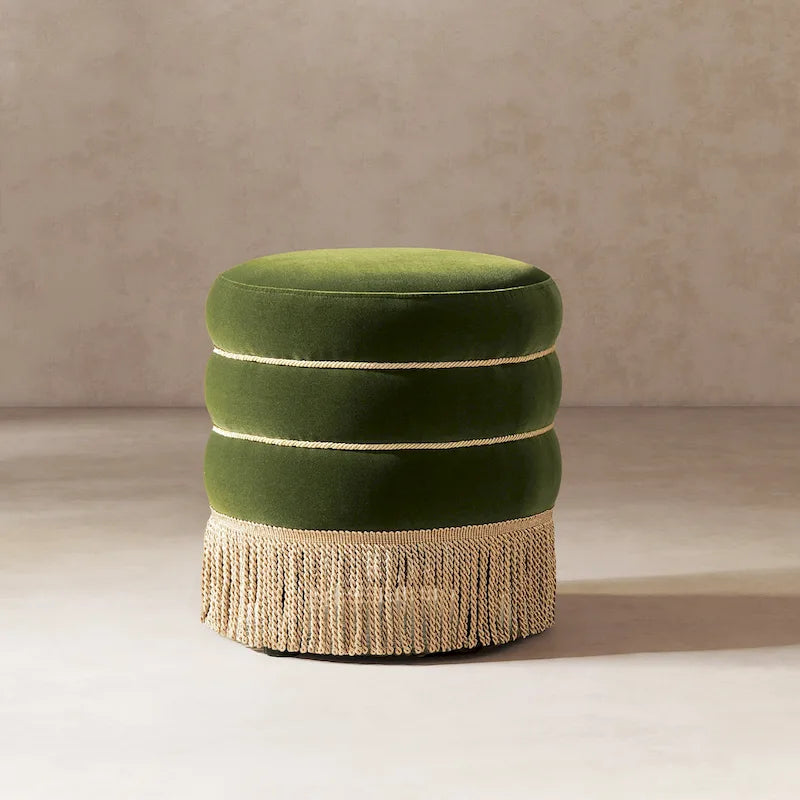 Pouf rond tapissé avec franges en fil doré