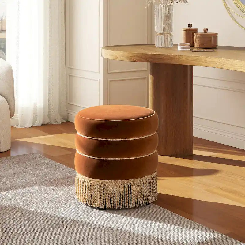 Pouf rond tapissé avec franges en fil doré