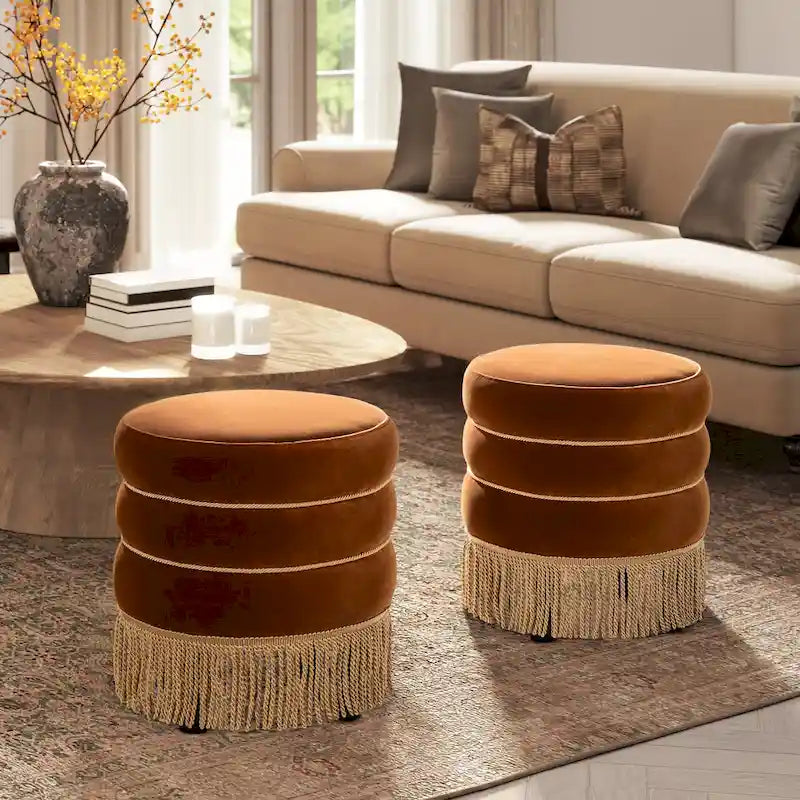 Pouf rond tapissé avec franges en fil doré