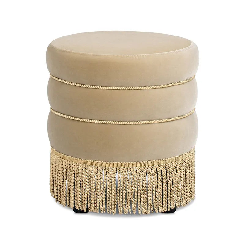 Pouf rond tapissé avec franges en fil doré