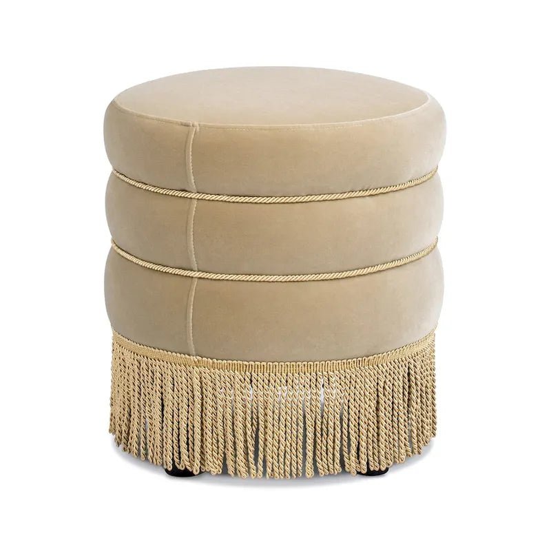 Pouf rond tapissé avec franges en fil doré
