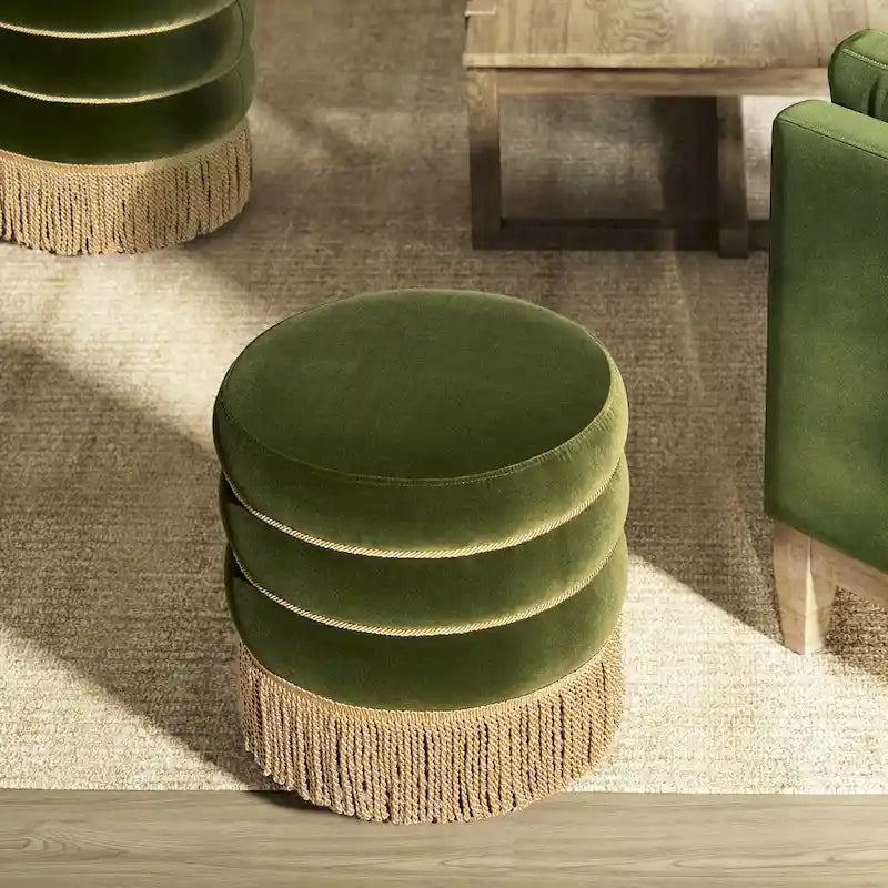Pouf rond tapissé avec franges en fil doré